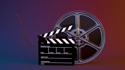 Clapper board and rotating film tape, 3d rendering. Stock Footage 140476965