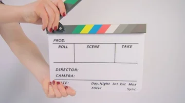 Clapper board being clapped on white background Stock Footage 85363543
