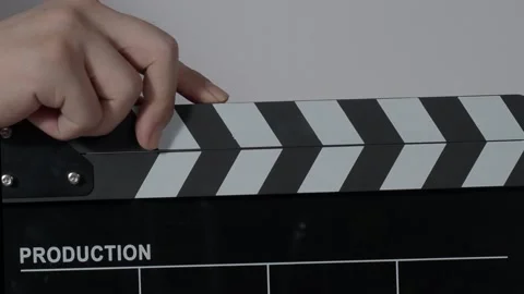 Clapper board. Close up hand and film making clapperboard isolated on backgro Stock Footage 167129062