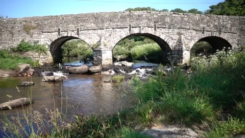 Clapper Bridge Postbridge Dartmoor England. Stock Footage 133499596