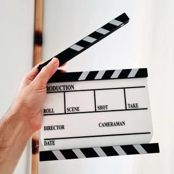 Clapperboard in Hand Stock Photos