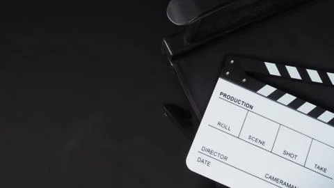 Clapperboard or clap board or movie slate with director chair use in video pr Stock Photos