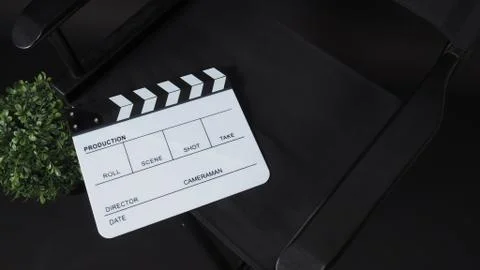 Clapperboard or clap board or movie slate with director chair use in video pr Stock Photos