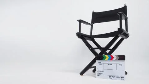 Clapperboard or movie slate with director chair on white background. Stock Photos