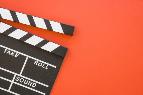 Clapperboard on red background with space. High quality photo Stock Photos