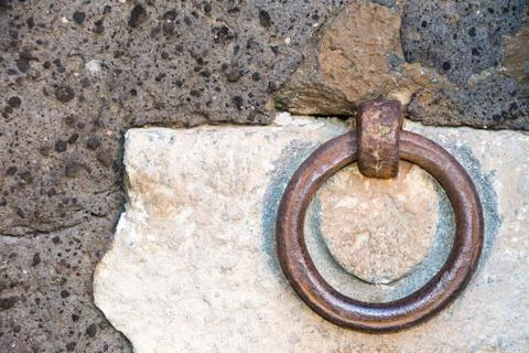 Clappers on an ancient stone wall Stock Photos