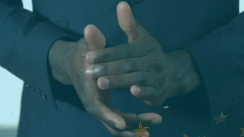 Clapping hands sending gold star confetti swirling around hands for flat design Stock Footage 329365438