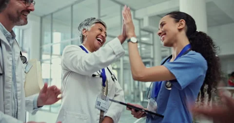 Clapping, high five and team of doctors in clinic cheering for a surgery success 動画素材 245343943