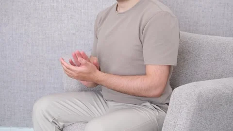 Clapping man on sofa Stock Footage 277693430