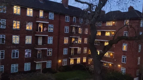 CLAPPING RITUAL FOR ESSENTIAL WORKERS DURING COVID-19 UK LOCKDOWN, 4K Stock Footage 127592761
