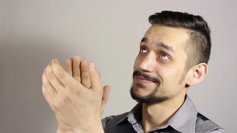 Clapping sarcastically. young bearded man applauding. Stockbeeldmateriaal 75351713