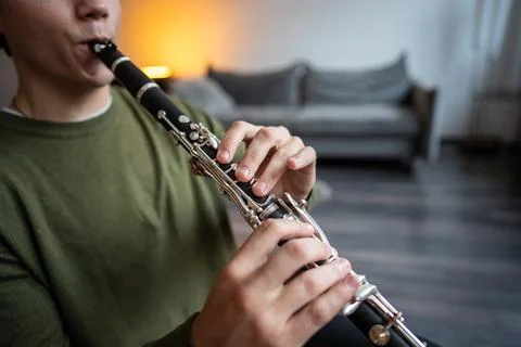 Clarinet player. Clarinetist hands playing flute woodwind music instrument .. Stock Photos