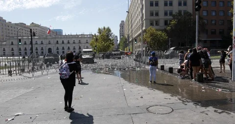 Clashes between protesters and the police in front of La Moneda Palace Stock-Footage 126167115