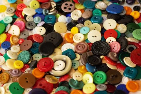 Clasp for loops, for clothes. Multicolored in a box and scattered. Stock Photos