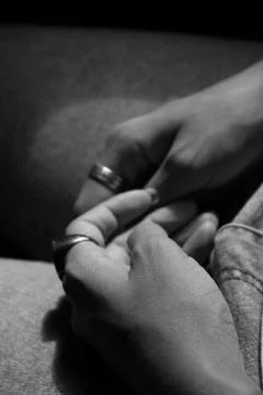 Clasped hands Stock Photos