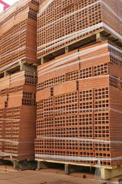 Class B engineering bricks stacked in a warehouse Stockfoto's
