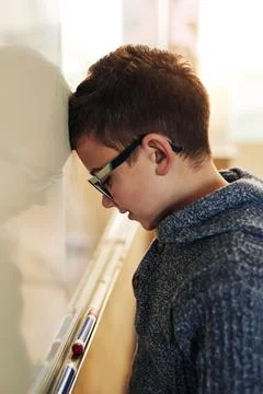 Class, board and frustrated boy kid with math problem solving, thinking and time Stock Photos