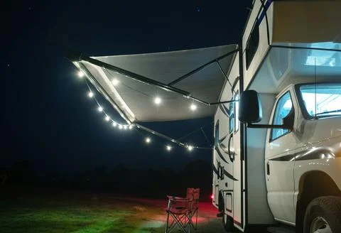 Class C Motorhome RV with String Lights on the Camper Awning Stock Photos