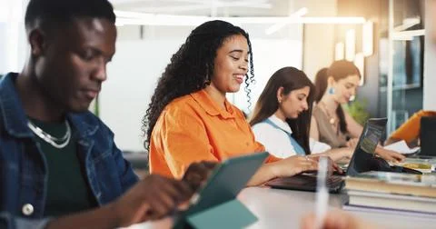 Class, college and students on tech for learning, studying and education at.. Stock Photos