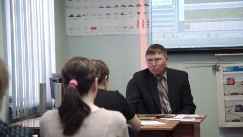 Class driving school, road signs, teacher man wearing glasses lectures a class Stock Footage 73429816