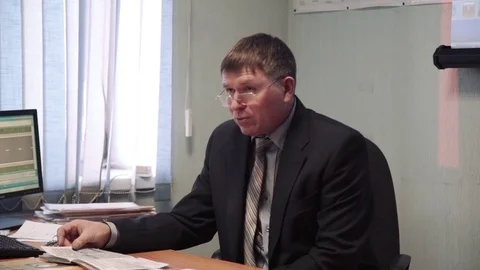 Class driving school, road signs, teacher man wearing glasses lectures a class Stock Footage 73430575
