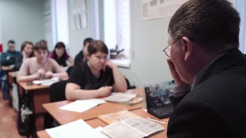 Class driving school, road signs, teacher man wearing glasses lectures a class Stock Footage 73430960
