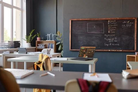 Class with IT Lesson on Blackboard Laptop on Desk 스톡 사진