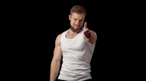 Class. The man shows thumbs up. Good job. I did it. Caucasian man on a black Stock Photos