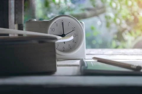 Class room in nature background with Green books pencils alarm clock on a whi Stock Photos