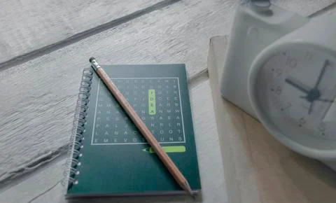 Class room in nature background with Green books pencils alarm clock on a whi Stock Photos