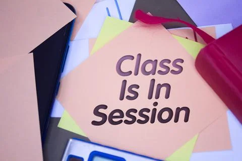 Class Is In Session. Text on adhesive note paper. Event, celebration reminder Stock Photos