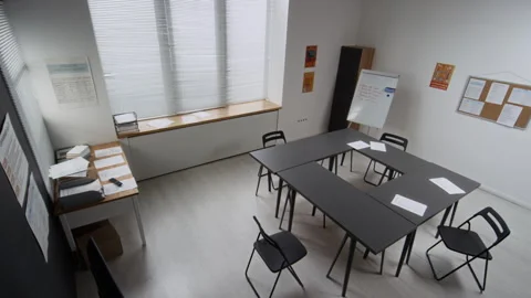 Class Setting with Tables and Board Waiting for Students in Prison Stock Footage 328987686