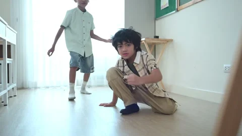 In class, The teacher and students sing together, and the boys dance happily Stock Footage 285251738