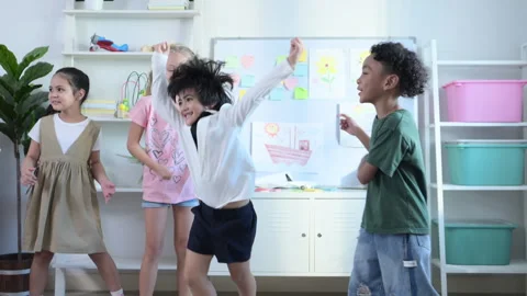 In class, The teacher and students sing and dance together Stock Footage 285325732