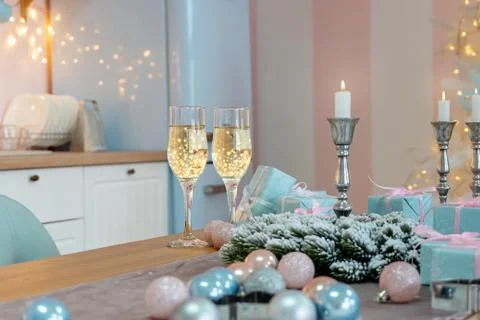Classes of champagne on a table surrounded by Christmas New year background a Stock-Fotos