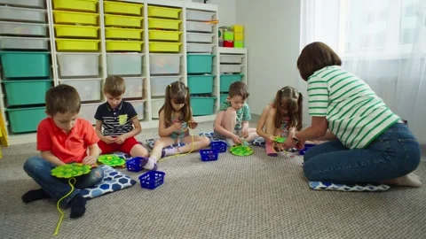 Classes with a teacher in kindergarten. Stock Footage 247992635