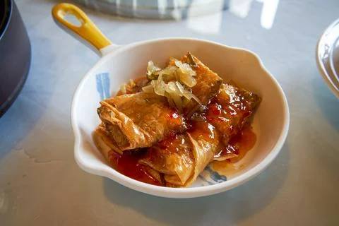 A classic and delicious Cantonese morning tea, steamed bean curd skin rolls Stock Photos