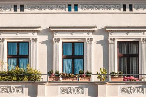 Classic apartment facade with flower boxes Stock Photos