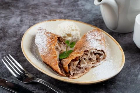 Classic apple strudel with raisin and cinnamon Stock Photos
