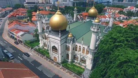 Classic architecture of Sultan mosque contrasts with modern Singapore Video stock 92192791