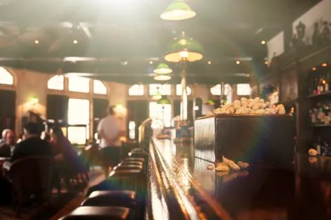 Classic bar counter with blurred background. Warm color Stock Photos