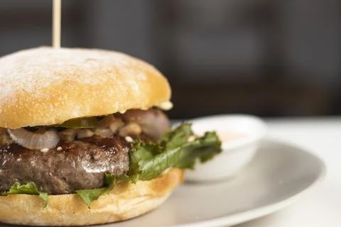 Classic Beef Burger with Mayo Dip served in plate isolated on white table a.. Stock Photos