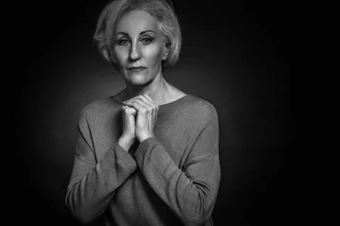 Classic black-and-white dramatic portrait of elderly blonde woman in Studio o Stock Photos