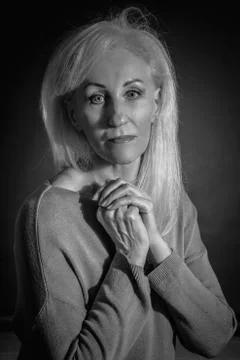 Classic black-and-white dramatic portrait of elderly blonde woman in Studio o Stock Photos