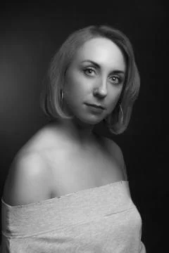 Classic black-and-white dramatic portrait of blonde woman in Studio on black  Stock Photos