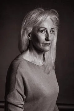 Classic black-and-white dramatic portrait of elderly blonde woman in Studio o Stock Photos