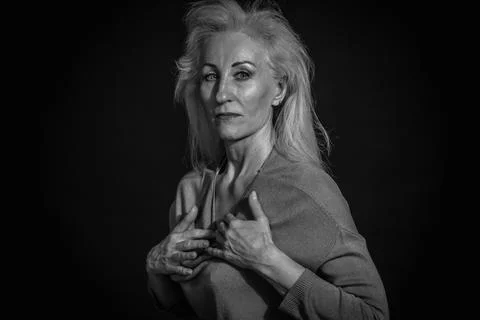 Classic black-and-white dramatic portrait of elderly blonde woman in Studio o Stock Photos