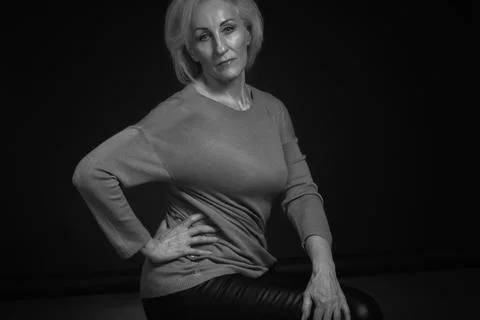 Classic black-and-white dramatic portrait of elderly blonde woman in Studio o Stock Photos