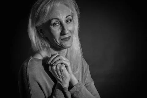 Classic black-and-white dramatic portrait of elderly blonde woman in Studio o Stock Photos