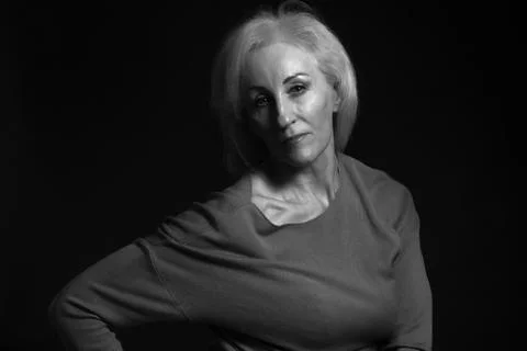 Classic black-and-white dramatic portrait of elderly blonde woman in Studio o Stock Photos